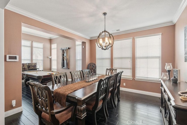 dining area featuring visible vents, dark wood-type flooring, baseboards, and ornamental molding