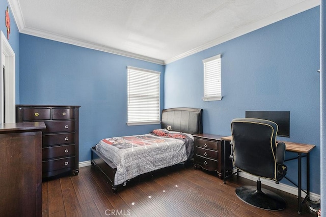 bedroom featuring baseboards, dark wood-type flooring, and crown molding