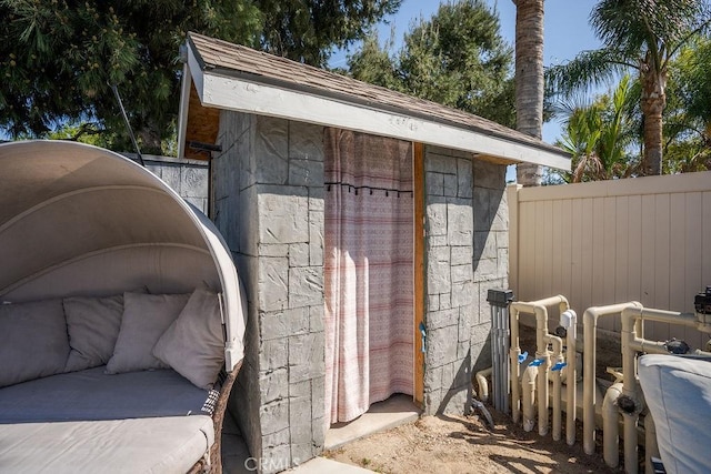 view of outdoor structure with fence