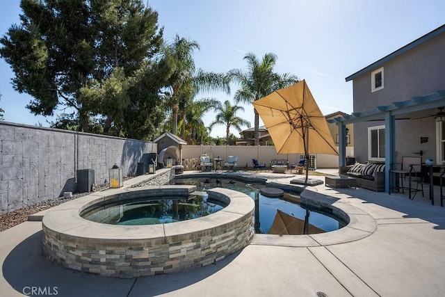 view of pool with a fenced backyard, a pool with connected hot tub, a pergola, and a patio