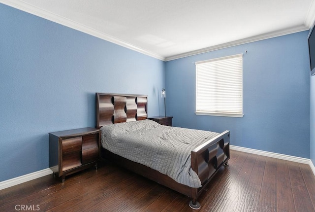 bedroom with baseboards, ornamental molding, and hardwood / wood-style flooring