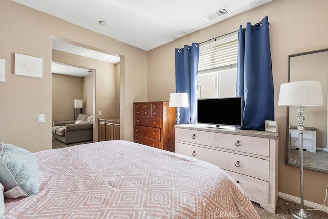 bedroom with visible vents and baseboards