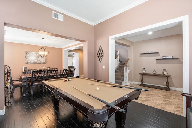 game room featuring dark wood-style floors, baseboards, visible vents, ornamental molding, and a notable chandelier