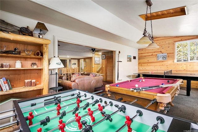 rec room with carpet, pool table, ceiling fan, and wooden walls