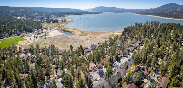 aerial view featuring a water and mountain view