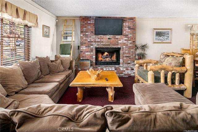 living room featuring a textured ceiling, ornamental molding, and a brick fireplace