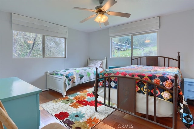 bedroom with ceiling fan and wood finished floors