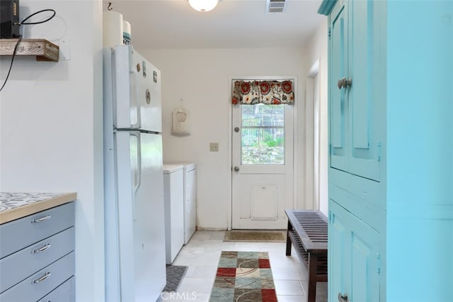 washroom featuring laundry area and visible vents