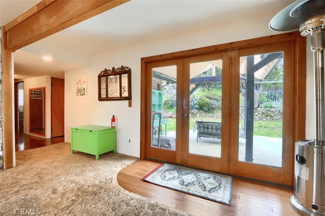 doorway to outside with wood finished floors