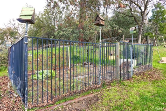 view of gate with fence