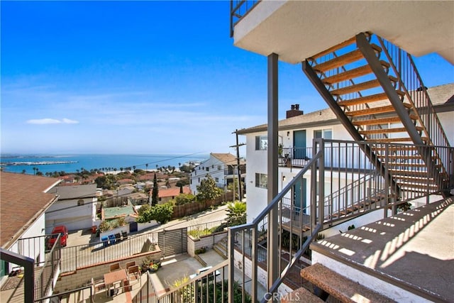 exterior space with a water view and a pergola