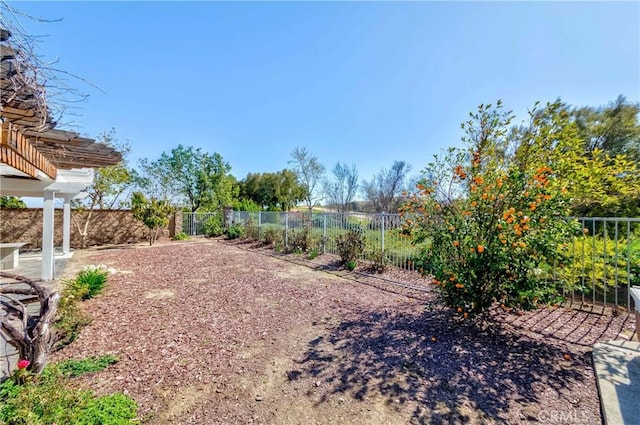 view of yard with a fenced backyard and a pergola