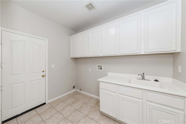 laundry area with cabinet space, light tile patterned floors, visible vents, washer hookup, and a sink