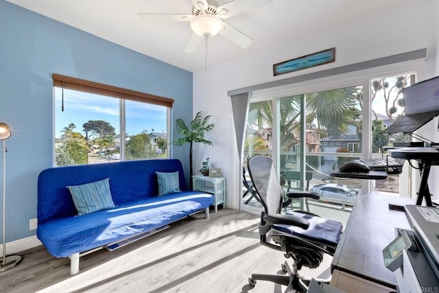 office area featuring ceiling fan, wood finished floors, and baseboards