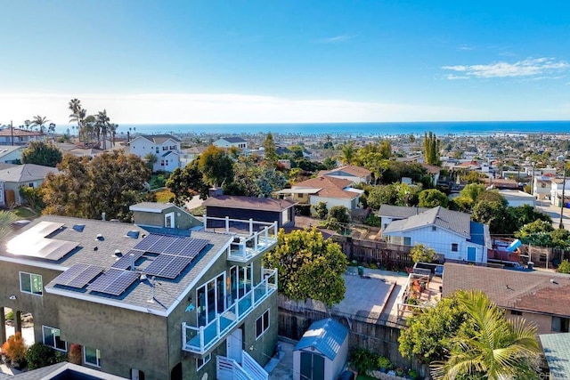 birds eye view of property with a residential view and a water view