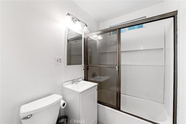 full bathroom with vanity, toilet, and enclosed tub / shower combo