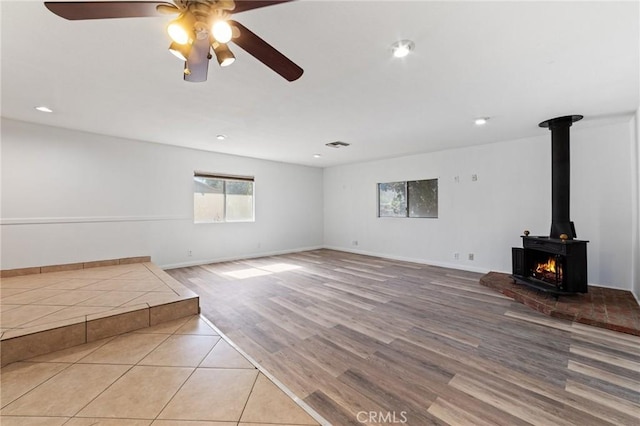 unfurnished living room with visible vents, recessed lighting, baseboards, and wood finished floors