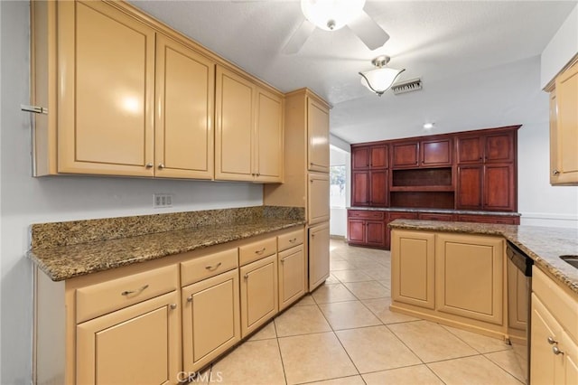 kitchen with a ceiling fan, visible vents, light tile patterned flooring, cream cabinetry, and stainless steel dishwasher