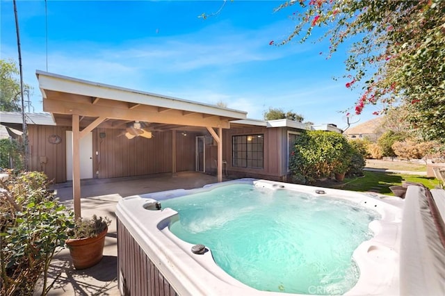 view of pool with a patio area, a ceiling fan, and a hot tub