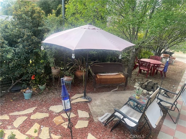 view of patio featuring outdoor dining space