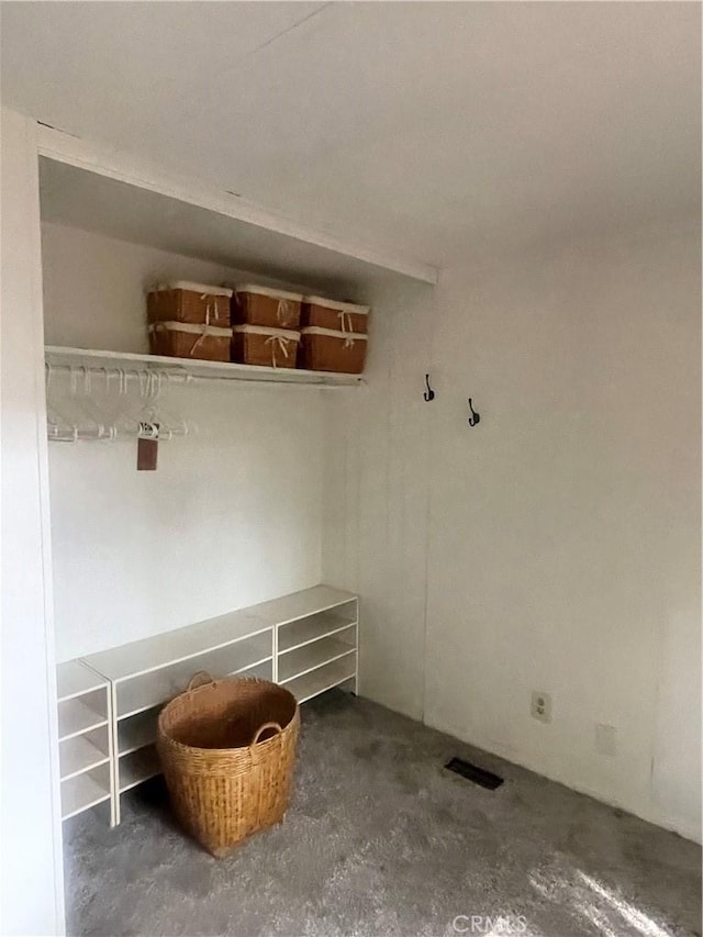 mudroom with unfinished concrete floors