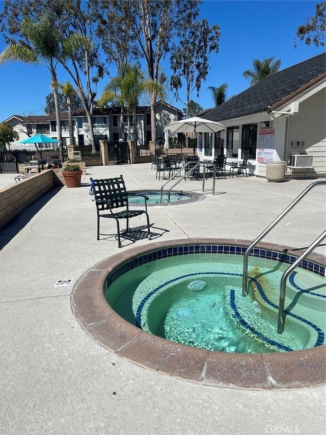 25885 Trabuco Rd Unit 271, Lake Forest, CA 92630 - view of pool with a patio area, a pool, and a hot tub