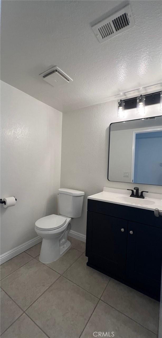 25885 Trabuco Rd Unit 271, Lake Forest, CA 92630 - half bath with vanity, tile patterned flooring, and a textured ceiling