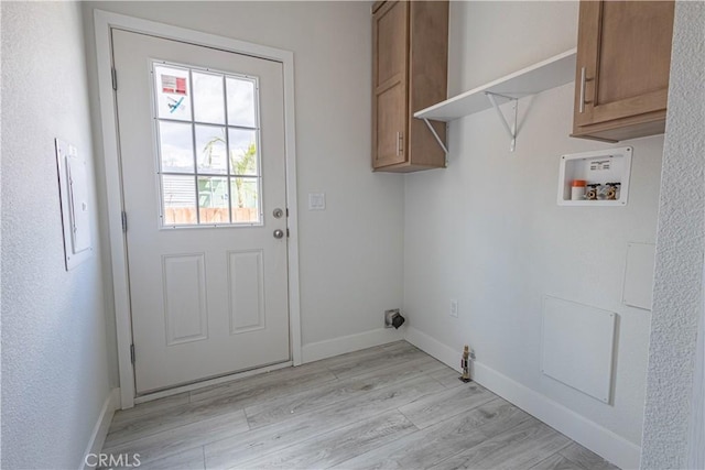 33112 Haddock St, Winchester, CA 92596 - laundry room with light wood-type flooring, washer hookup, and baseboards
