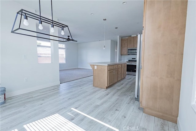 33112 Haddock St, Winchester, CA 92596 - kitchen featuring stainless steel appliances, open floor plan, baseboards, and a center island
