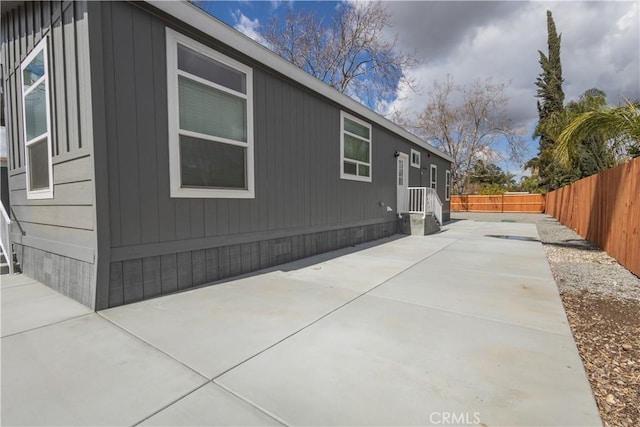 33112 Haddock St, Winchester, CA 92596 - view of side of home with a fenced backyard and a patio