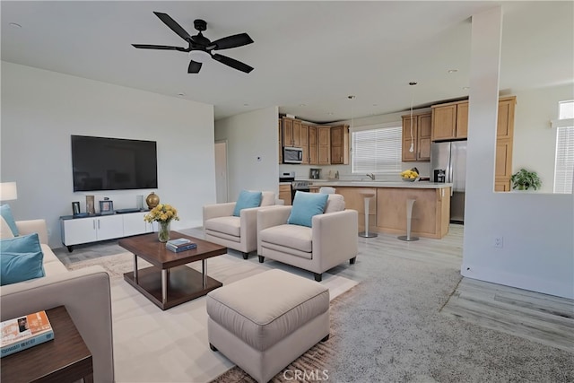33112 Haddock St, Winchester, CA 92596 - living area featuring ceiling fan and light wood-type flooring