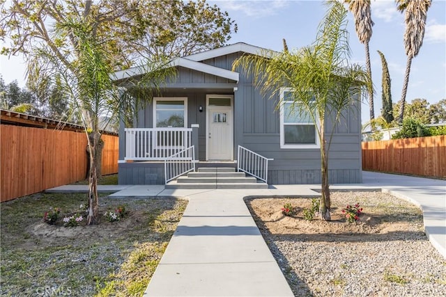33112 Haddock St, Winchester, CA 92596 - view of front of house with board and batten siding, fence, and covered porch