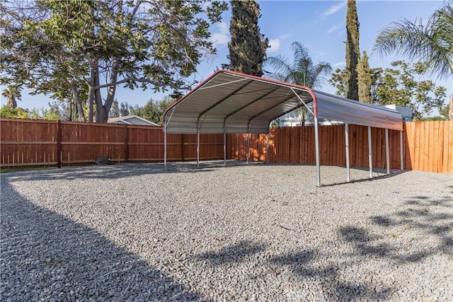 33112 Haddock St, Winchester, CA 92596 - view of yard with a detached carport, fence, and gravel driveway