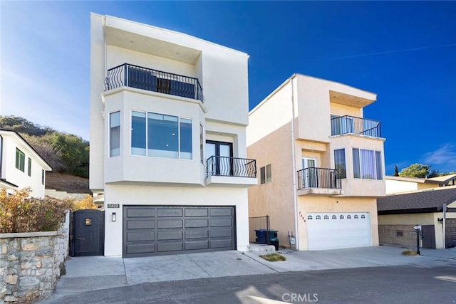 view of front of property with an attached garage and stucco siding