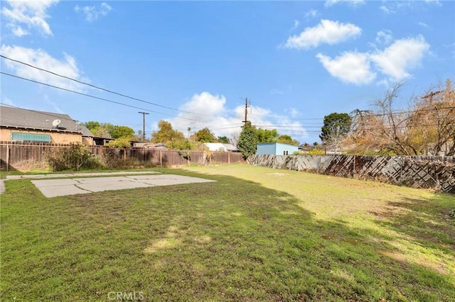 view of yard with a fenced backyard and a patio