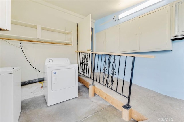 clothes washing area featuring washer and dryer