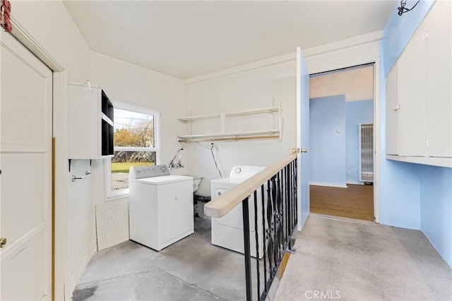 washroom with laundry area and independent washer and dryer