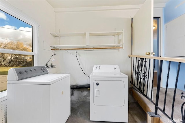 laundry room featuring laundry area and washing machine and clothes dryer