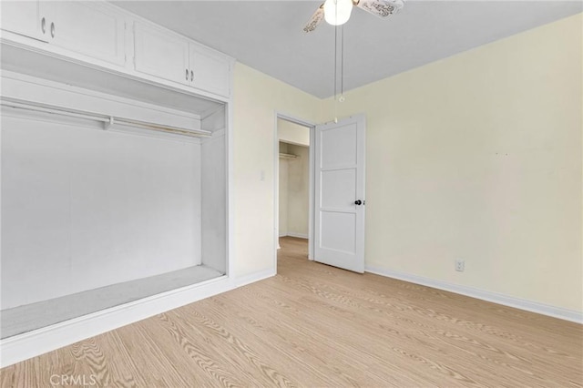 unfurnished bedroom with a ceiling fan, a closet, baseboards, and light wood finished floors