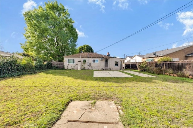 view of yard with a patio area and a fenced backyard