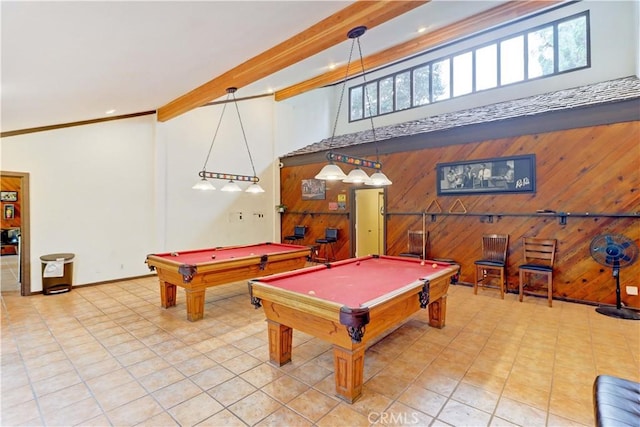 recreation room with beam ceiling, crown molding, a high ceiling, wood walls, and billiards