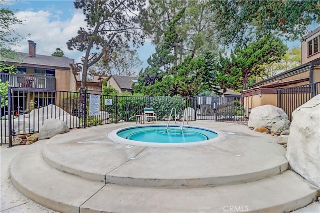 view of pool with fence