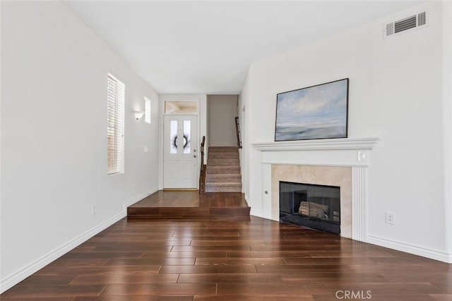 27139 Saddlepeak Trl, Valencia, CA 91354 - unfurnished living room with a fireplace, visible vents, baseboards, and wood finished floors