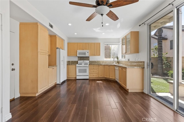 27139 Saddlepeak Trl, Valencia, CA 91354 - kitchen with dark wood-type flooring, visible vents, white appliances, and light brown cabinets