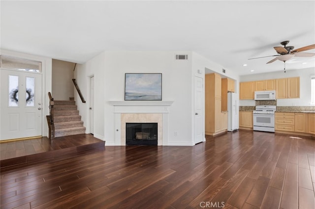 27139 Saddlepeak Trl, Valencia, CA 91354 - unfurnished living room with plenty of natural light, visible vents, ceiling fan, and dark wood finished floors