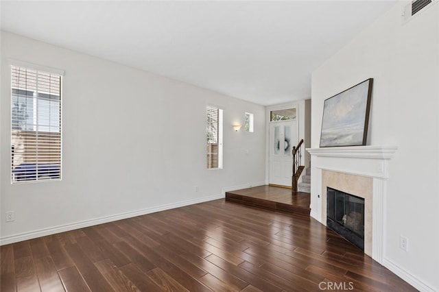 27139 Saddlepeak Trl, Valencia, CA 91354 - unfurnished living room with visible vents, baseboards, and wood finished floors