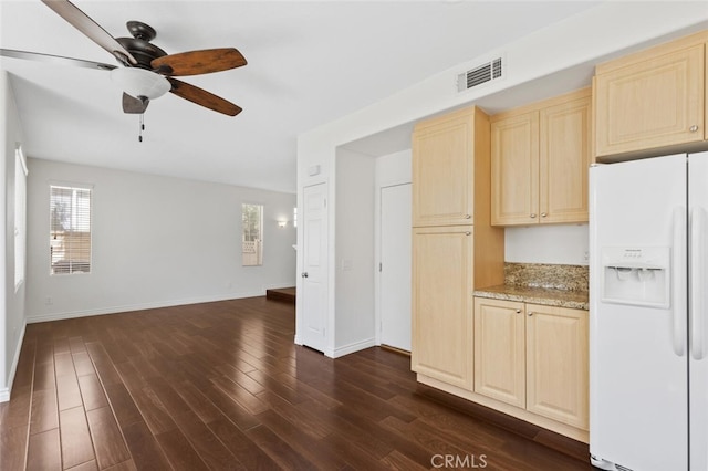 27139 Saddlepeak Trl, Valencia, CA 91354 - kitchen with open floor plan, visible vents, white refrigerator with ice dispenser, and baseboards