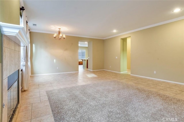 unfurnished room featuring a fireplace, an inviting chandelier, ornamental molding, light tile patterned flooring, and baseboards