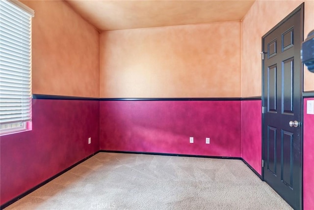 unfurnished room featuring carpet floors