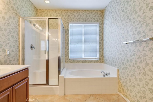 bathroom with wallpapered walls, vanity, a shower stall, a bath, and tile patterned floors